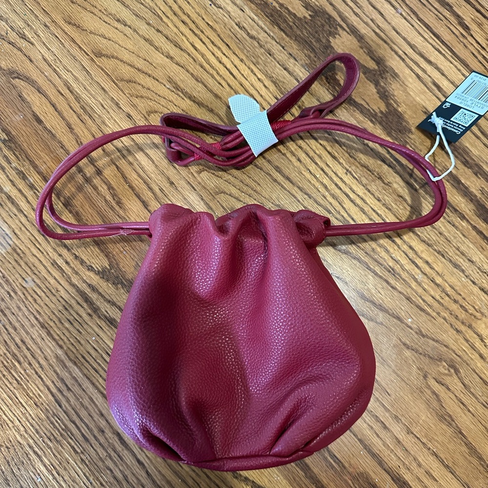 The Sak Loelie small soft red leather drawstring crossbody. So luxurious!